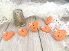 Bouton petit coeur orange clair